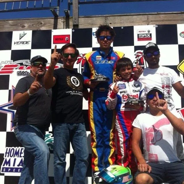 VMotorsport team members in World and National Champions shirts
