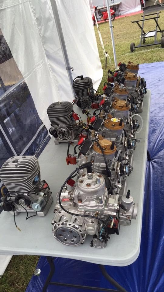 Kart engines laid out on a table at the track