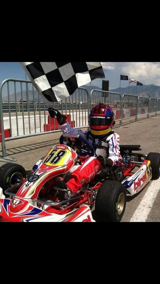Race kart taking the checkered flag on track