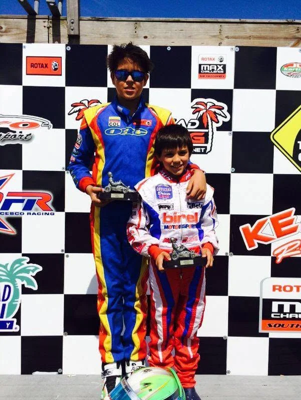 Two VMotorsport drivers on the podium after a race